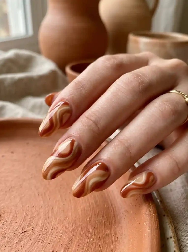 19. Terracotta Swirl Nails