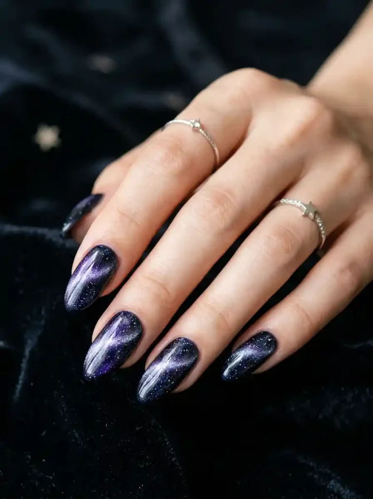 22. Galaxy Glow Cat Eye Nail Designs
