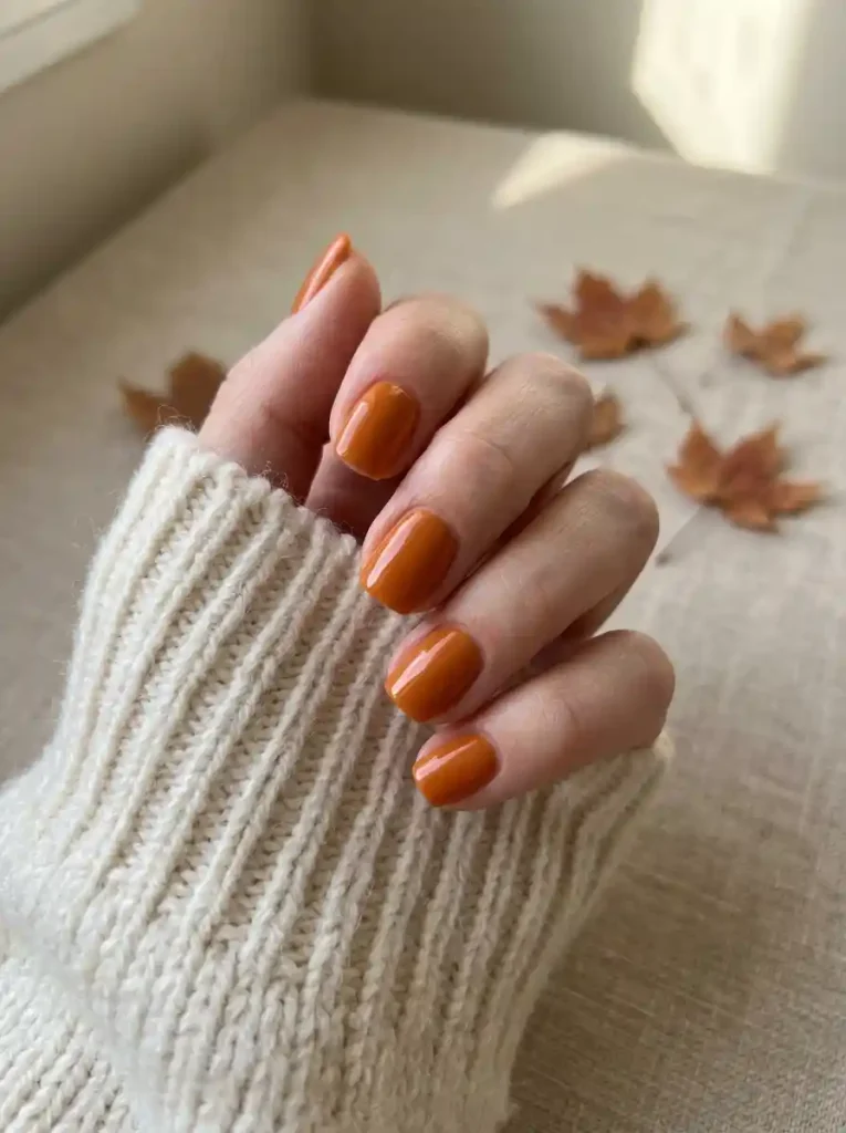 1. Glossy Pumpkin Orange-October Nails Ideas